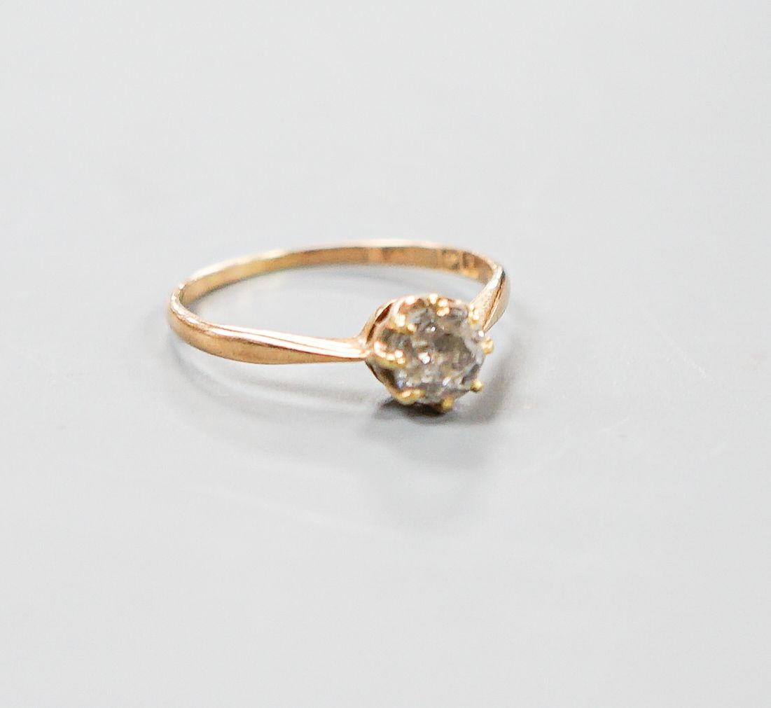 A George V 18ct gold and claw set solitaire diamond ring, size N/O, gross 1.6 grams.